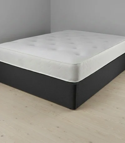 person sleeping comfortably on supportive mattress for back pain relief