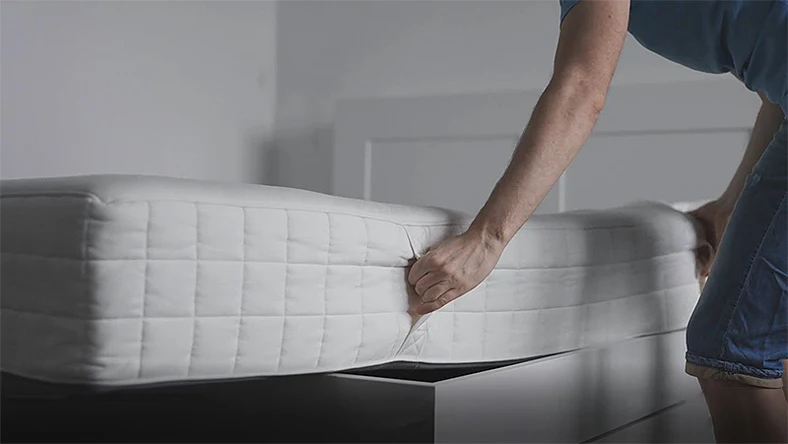 person sleeping comfortably on supportive mattress for back pain relief